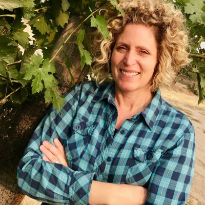 Holly posing in vineyard 2018